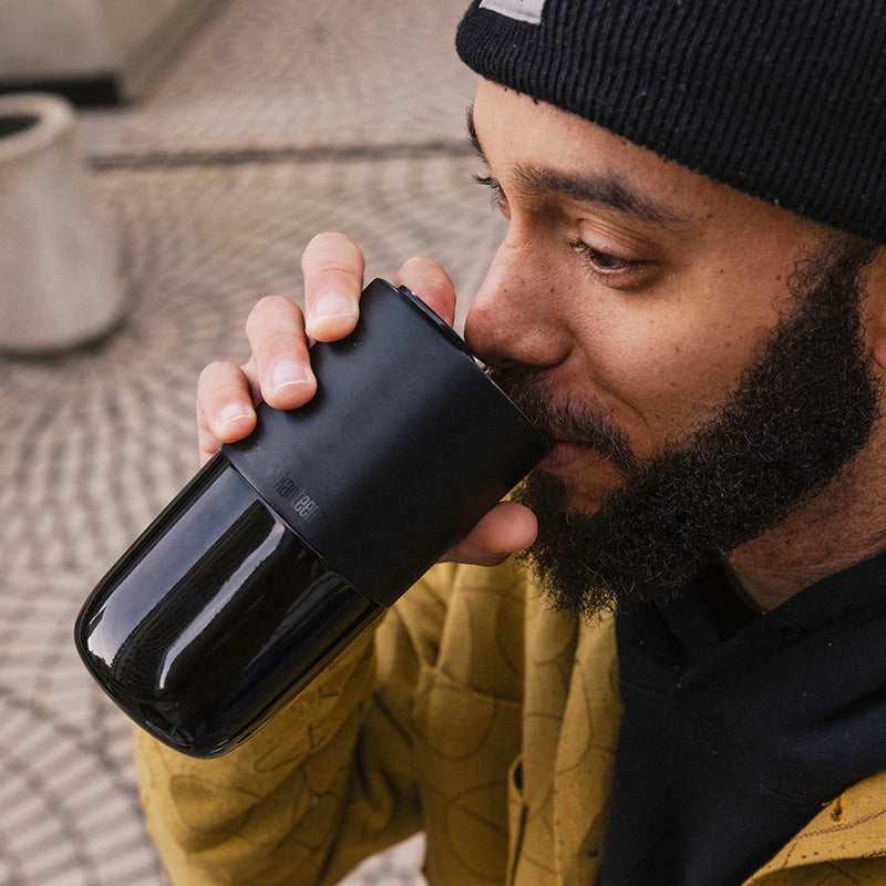 16oz-rise-tumbler-h7 16oz_rise_tumbler_black_man_drink_square.jpg