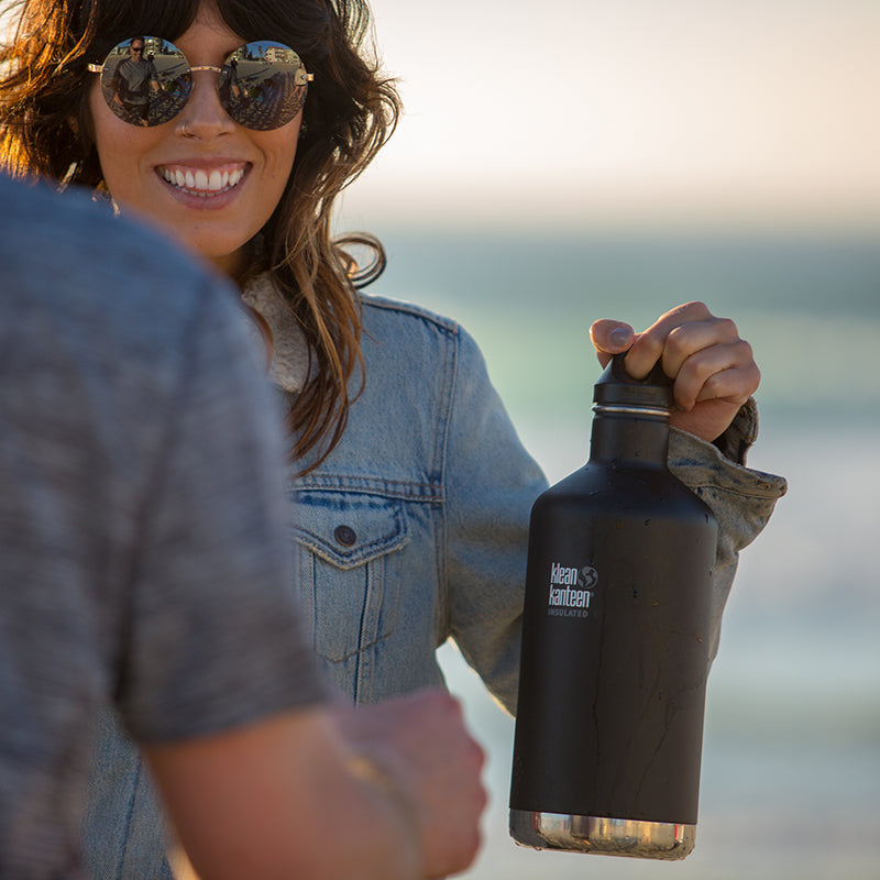 64oz-classic-with-loop-cap-p7 64oz_insulated_classic_black_beach_girl_hand_square.jpg